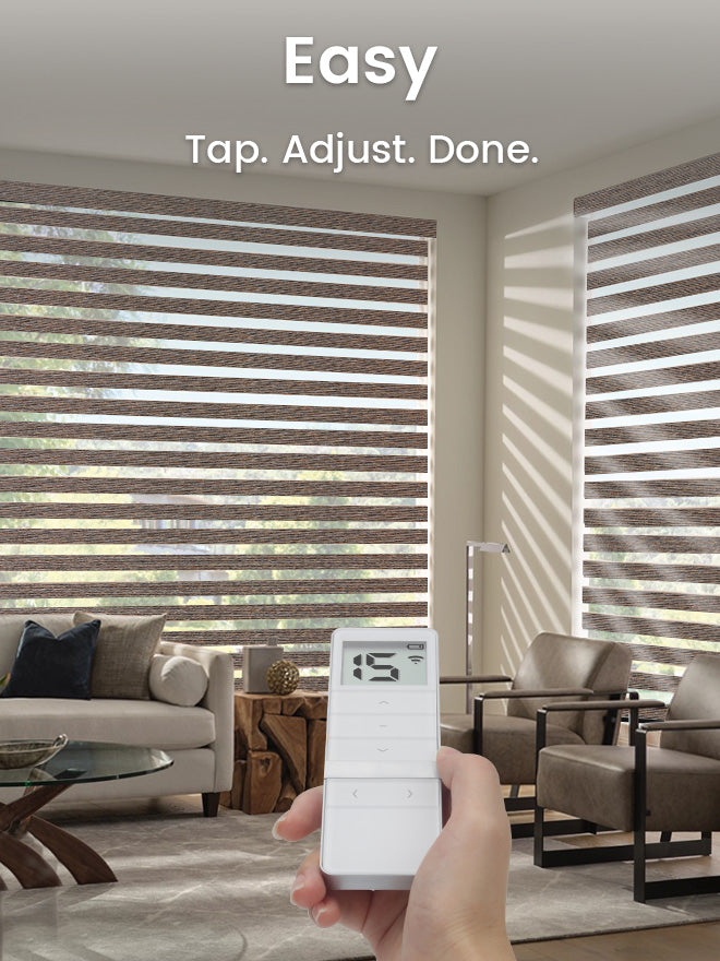 Living room with motorized blinds and a remote control, featuring the text 'Easy Tap. Adjust. Done.'